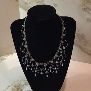 Short silver necklace with small blue beads